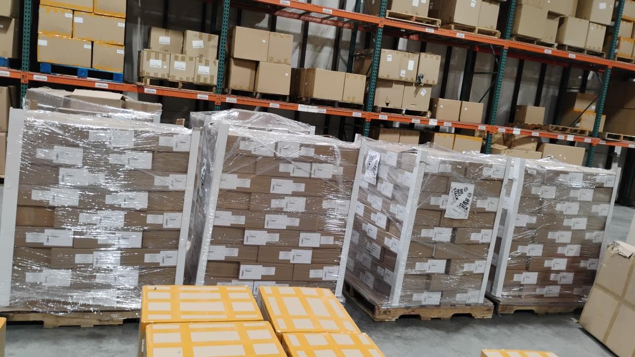 Shrink-wrapped pallets of cartons staged inside the RitePrep warehouse in Austin, Texas